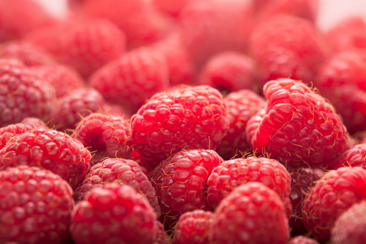 Background ripe juicy raspberries